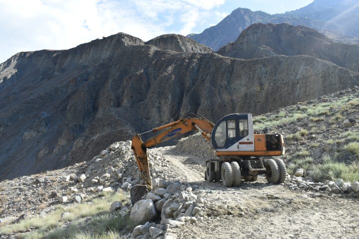 Excavator at work on FMR construction, Gulapur, Punyal, Ghizer